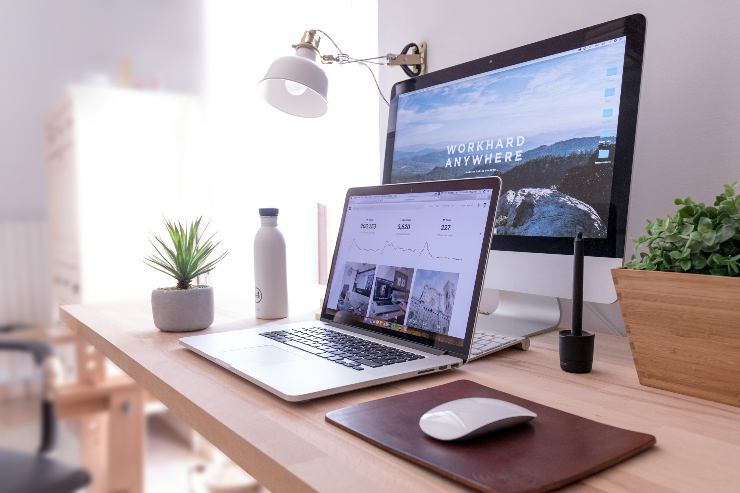 curated home office with monitors by domenico loia hgv2tfoh0ns unsplash